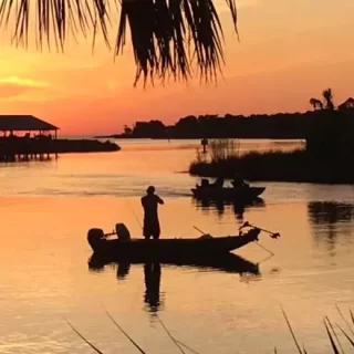 The good life. Orange sunset over Suwannee and fishing.